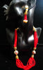 Pleasing and graceful necklace laden with exquisite work of red crystals, beautiful pearls and kundan