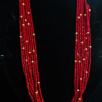 Pleasing and graceful necklace laden with exquisite work of red crystals, beautiful golden balls
