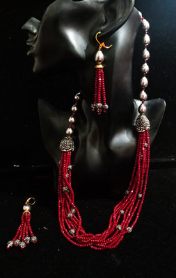 Pleasing and graceful necklace laden with exquisite work of wine colored crystals, beautiful high quality pearls