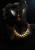 Pleasing and graceful Jaipur necklace laden with exquisite work of red & off white pearls .