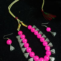 Pleasing and graceful Jaipur necklace laden with exquisite work of pink pearls .