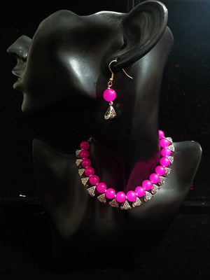 Pleasing and graceful Jaipur necklace laden with exquisite work of pink pearls .