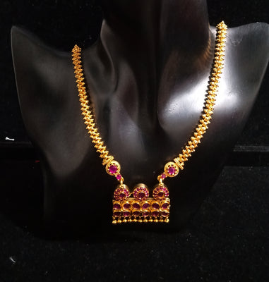 Pleasing and graceful gold plate-ted necklace laden with exquisite work of pink ruby