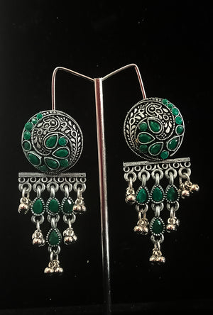 Silver oxidized earrings with green ruby studded and exclusive silver work for a stunning and stylish look.