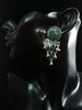 Silver oxidized earrings with green ruby studded and exclusive silver work for a stunning and stylish look.