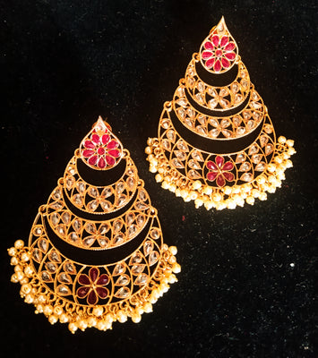 Classy light weight large in size earring with delicate work of pearl & high quality American diamond studded & Meenakari work.