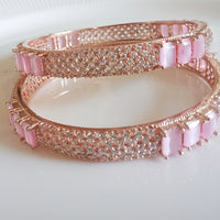 B046_ Classy Rose Gold plated bangles studded with  American Diamond stones.
