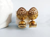 E0141_Glossy Golden Meenakari jumkas studded with stones.