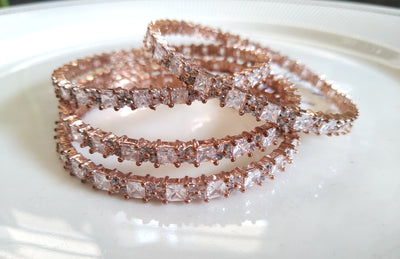 B056_ Classy Rose Gold plated bangles studded with  American Diamond stones.