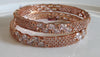 B057_ Classy Rose Gold plated bangles studded with  American Diamond stones.