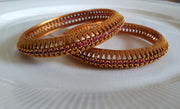 B059_Gorgeous Gold plated bangles studded with pink ruby stones.