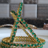 B061_Gorgeous Gold plated bangles studded with  American Diamond stones.