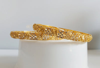 B064_Gorgeous Gold plated bangles  studded with  American Diamond  stones.