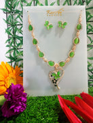 N091_Fancy necklace set studded  with a touch of  green colored stones.