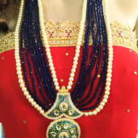 N0133_Gorgeous elaborated blue color Crystal  layered necklace set studded with kundan stones with a touch of pearls.