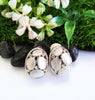 E0417_Classy studs studded with grey & white color stones with touch of metal base.