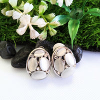 E0417_Classy studs studded with grey & white color stones with touch of metal base.