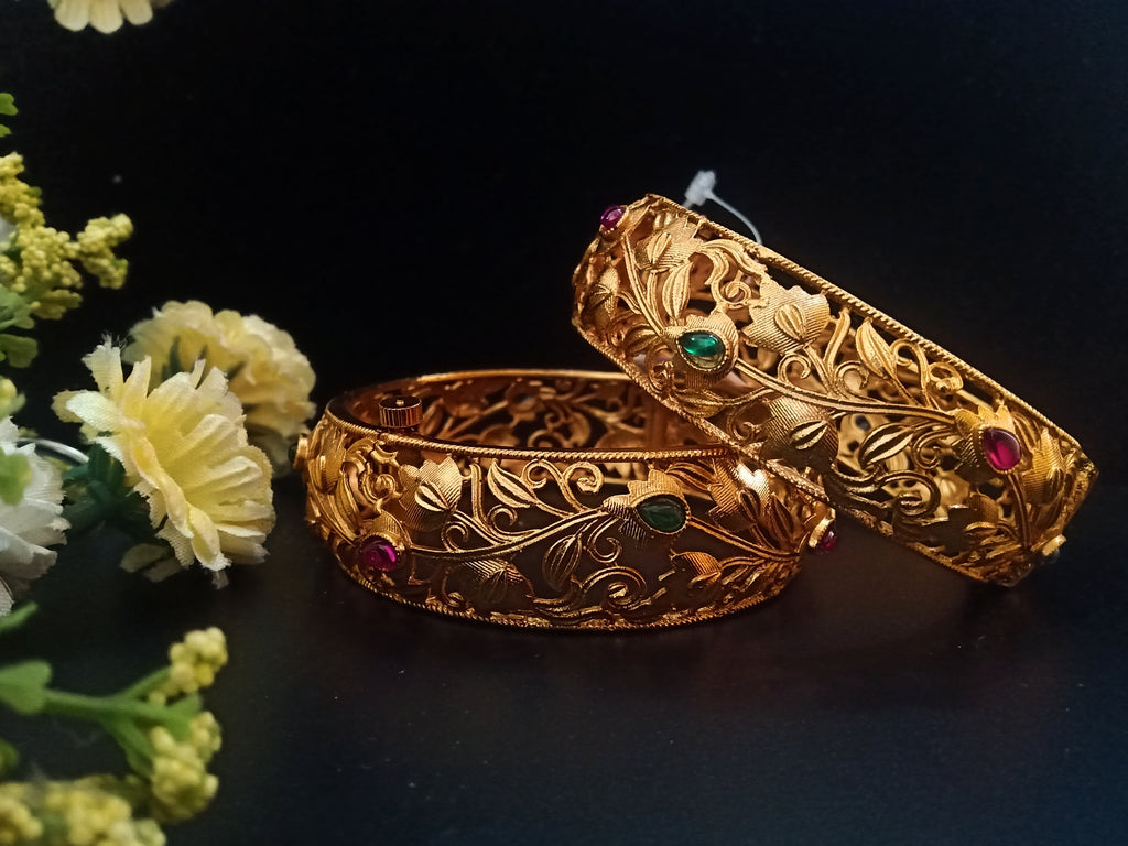 B045_Gorgeous Matte Gold  plated bangles studded with pink and green ruby stones.