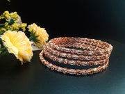 B058_ Classy Rose Gold plated bangles studded with  American Diamond stones.