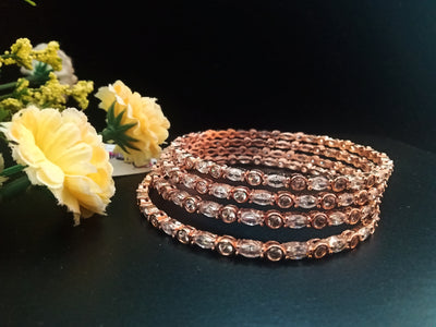 B058_ Classy Rose Gold plated bangles studded with  American Diamond stones.