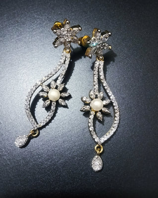 E0804_Elegant dazzling flower design american diamond stone studded earring with a touch of pearl.