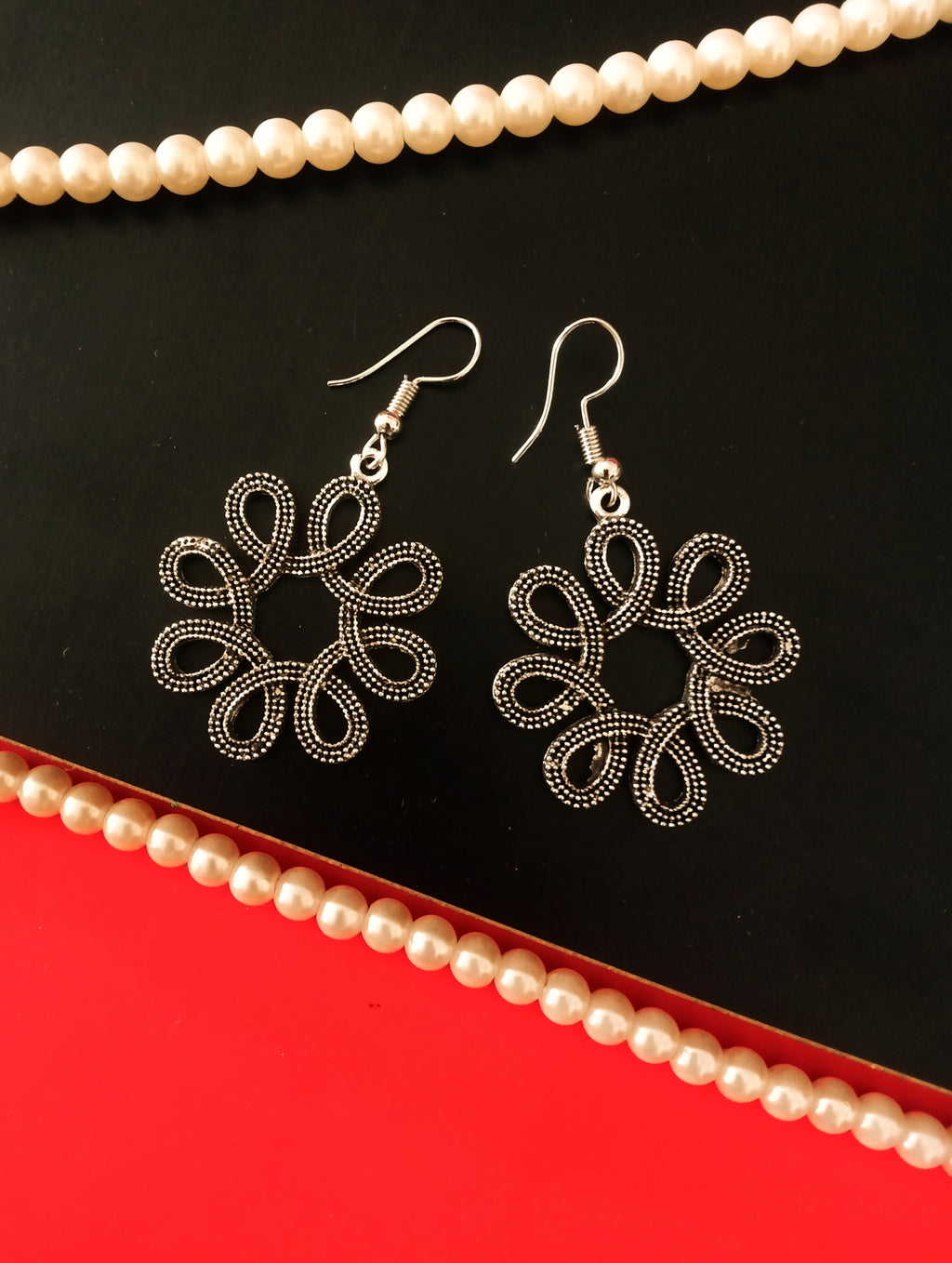 E0528_ Elegant German Silver oxidized crafted floral shaped earring with delicate art work (medium size).