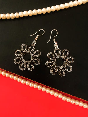 E0528_ Elegant German Silver oxidized crafted floral shaped earring with delicate art work (medium size).