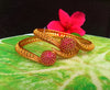 B069_Gorgeous Gold plated bangles studded with pink ruby stones.