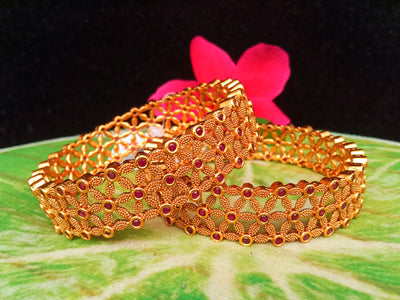 B084_Gorgeous  Matte Gold  finish  bangles studded with ruby stones.