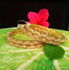 B062_Gorgeous Gold plated bangles studded with  American Diamond stones.