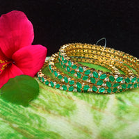 B061_Gorgeous Gold plated bangles studded with  American Diamond stones.