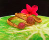 B069_Gorgeous Gold plated bangles studded with pink ruby stones.