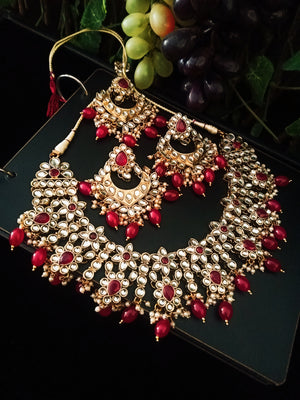 N0222_Classic Elaborated Kundan choker necklace set with floral designs and with a touch of glossy red beads .