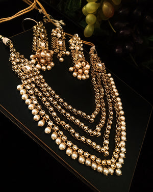 N0218_Classic Elaborated Layered choker necklace set studded with Kundan stones with a touch of glossy pearls.