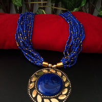 N0244_ Classic Off beat necklace with over sized circular pendant with a blue color stone with beautiful craft work followed by layered bead chains.