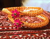 B037_Classy Gold plated bangles studded with pink ruby stones.