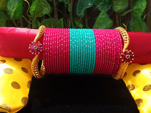 B0127_Exquisite bangle set of colorful metal bangles along with Matte gold plated bangles with a touch of stones.