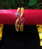 B037_Classy Gold plated bangles studded with pink ruby stones.