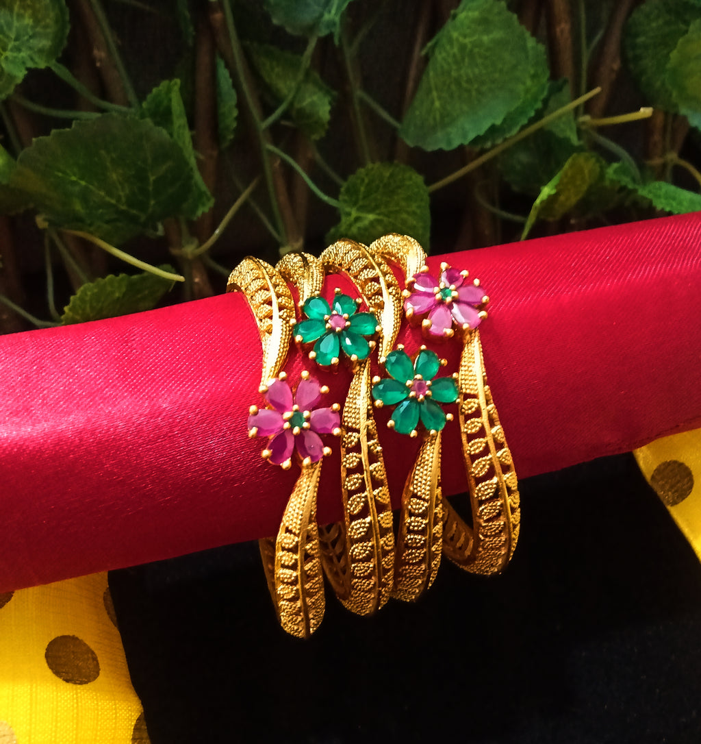 B0129_Exquisite Matte gold plated bangles set with a touch of stones with delicate flower design.