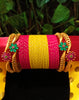 B0130_Exquisite bangles set with colorful metal bangles along with Matte gold plated bangles with a touch of stones with delicate flower design.