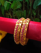 B034_Gorgeous Gold plated bangles matte finish studded with pink ruby stones.