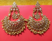 E18_Sparkling Golden colored AD stone crafted earrings with elegant Meenakari work.