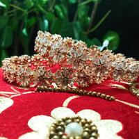 B0155_S_Elegant Rose gold bangle with flower design studded with American Diamond stones.