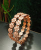 B0155_S_Elegant Rose gold bangle with flower design studded with American Diamond stones.