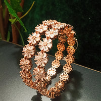 B0155_S_Elegant Rose gold bangle with flower design studded with American Diamond stones.