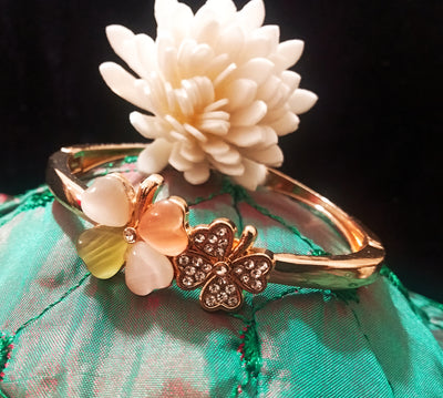 B0113_Elegant  metal base color flower design bracelet studded with  stones (Free size).