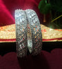 B0158_Elegant design silver crafted bangle studded with American Diamond stones.