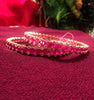 B0163_Elegant Golden crafted bangles studded with pink ruby stones with a touch of American Diamond stones.