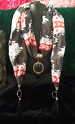 Lovely Soft Multi Colored Pattern Pendant Scarf with a touch of tassels.