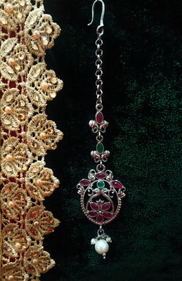 M011_Lovely semi precious Pink & Green ruby stone studded silver base color Maang Tika with touch of pearls.